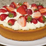 A freshly baked Strawberry Earthquake Cake with a cracked top, revealing gooey cream cheese swirls, melted white chocolate, and fresh strawberry slices.